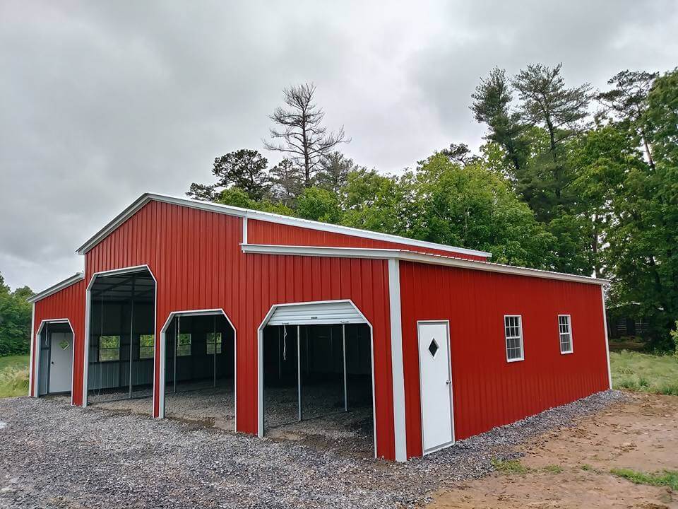 Red metal barn with covered carport in Utah